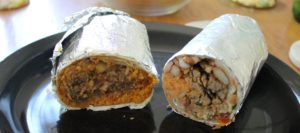 This is a side by side picture of the the best carne asada burrito in San Luis Obispo from Taqueria Santa Cruz next to a steak burrito from Taco Roco.
